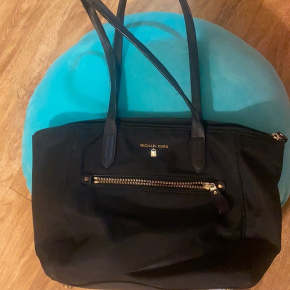 Michael Kors Handbags - Michael Kors black bag with studded bottom